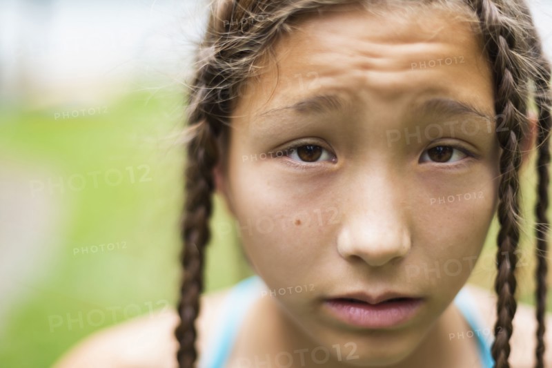 Mixed race girl with braids