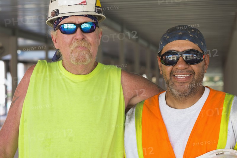 Workers smiling at construction site