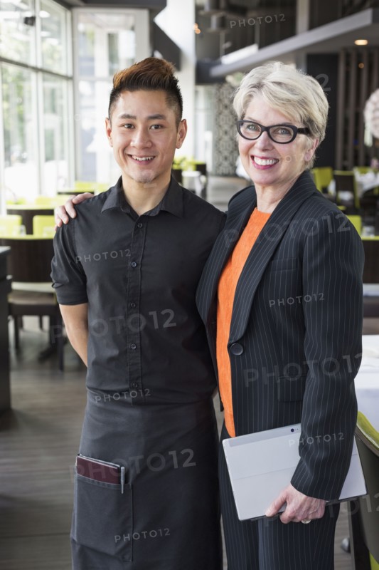 Businesswoman and water smiling in restaurant
