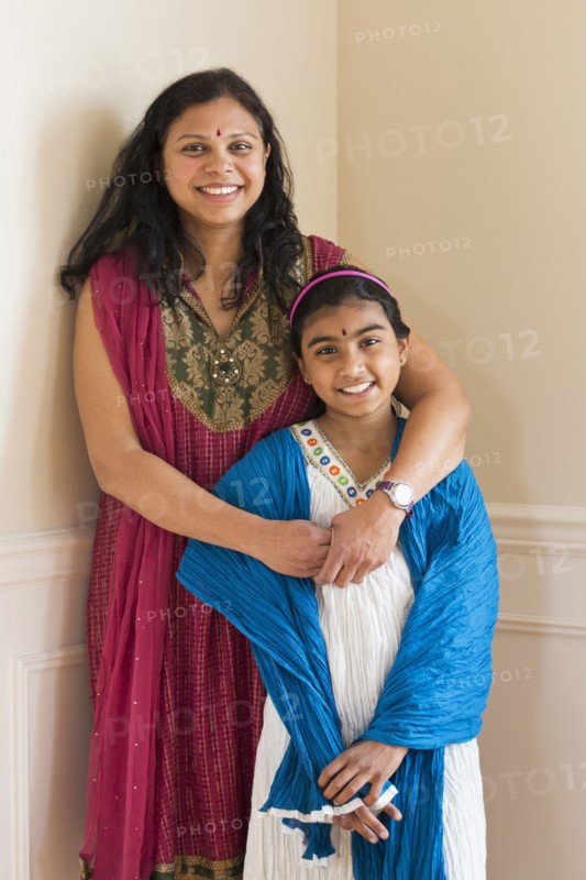 Indian mother and daughter wearing traditional dresses