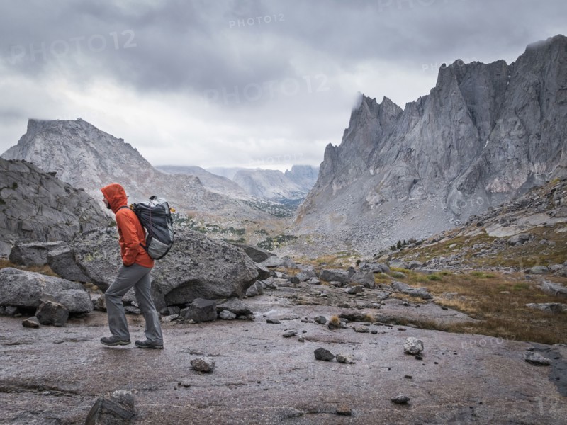 Caucasian hiker walking near mountains