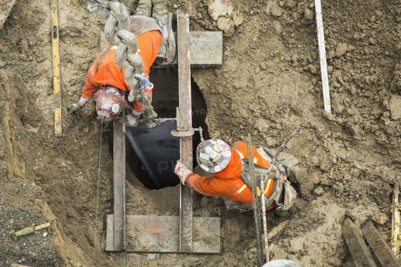 Caucasian workers building at construction site