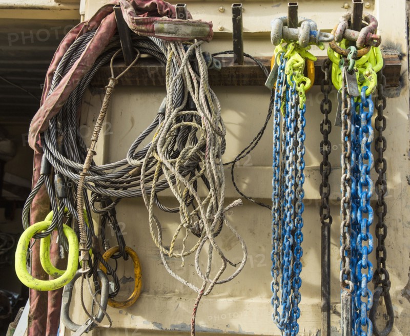 Chains and cords hanging on hooks
