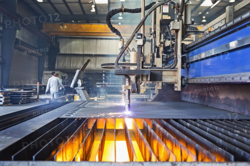 Machinery fabricating metal in factory