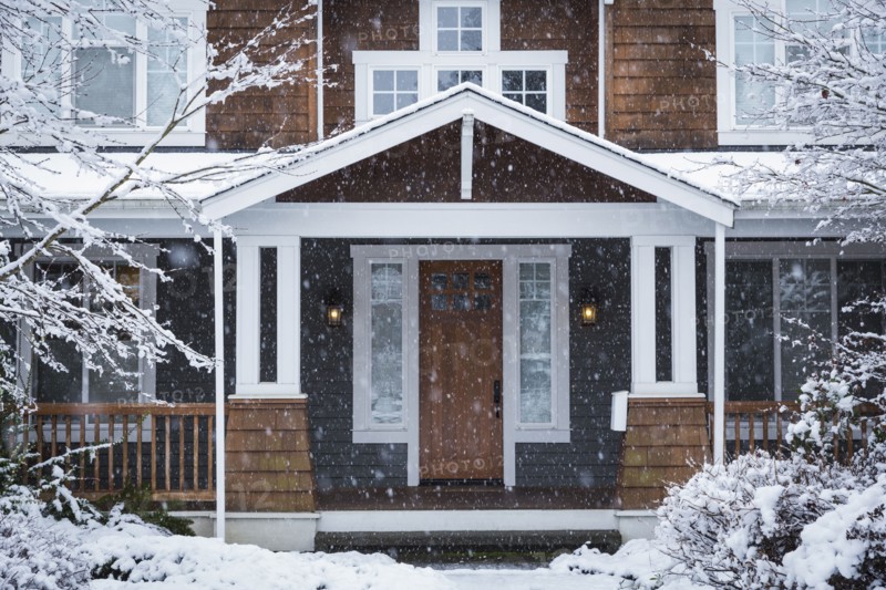 Snow falling near house