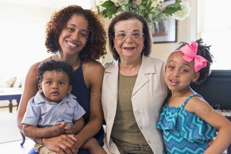 Portrait of smiling mixed race multi-generation family