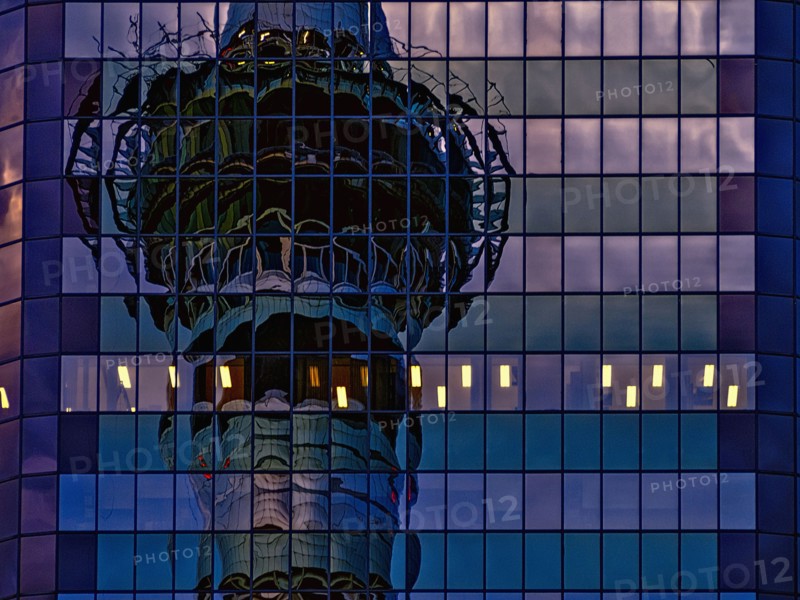 Skytower reflected in skyscraper windows