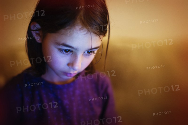 Mixed race girl looking down
