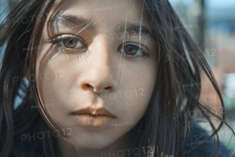Close up of face of mixed race girl