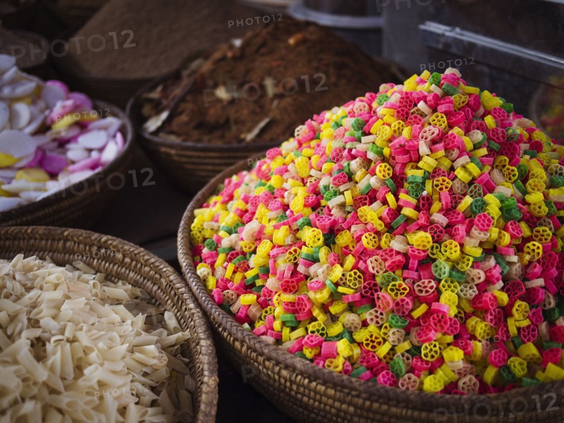 Bowls of grains and dried pasta for sale in market