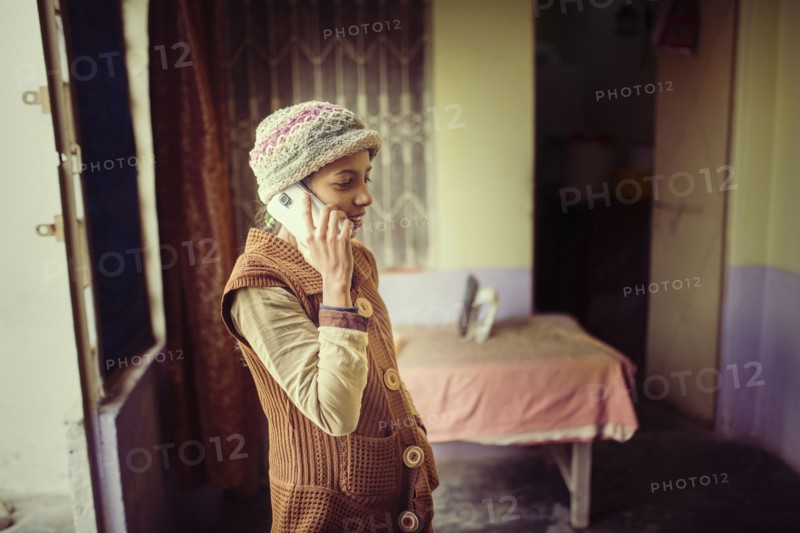 Woman in knit hat talking on cell phone