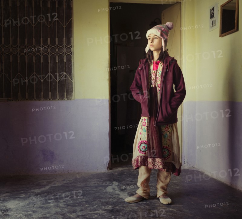 Mixed race girl wearing traditional clothing