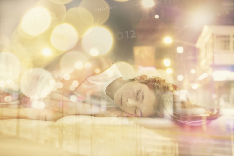 Mixed race girl dreaming of city at night