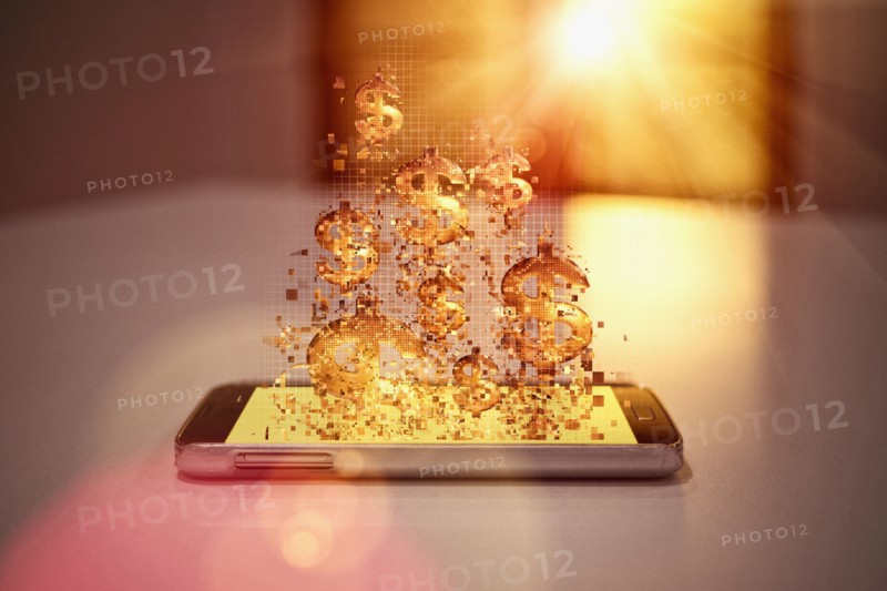 Pixelated dollar signs floating over cell phone