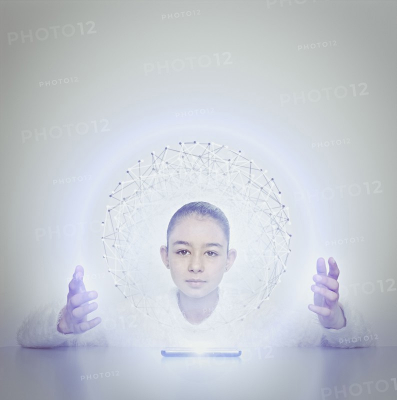 Mixed race girl holding sphere from digital tablet
