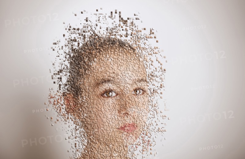 Pixelated mixed race girl with serious expression