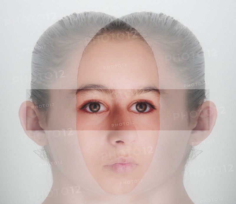 Double exposure of face of mixed race girl