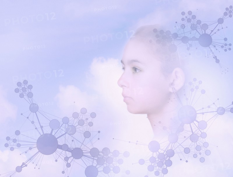 Face of mixed race girl floating in sky with molecule patterns