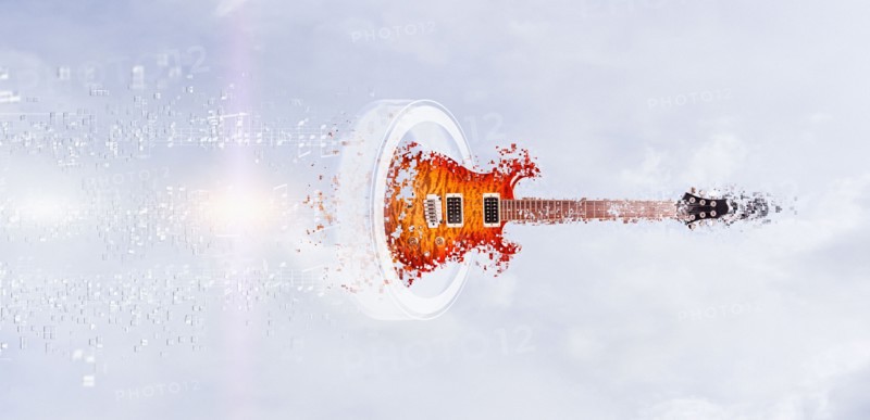 Pixelated guitar floating in sky