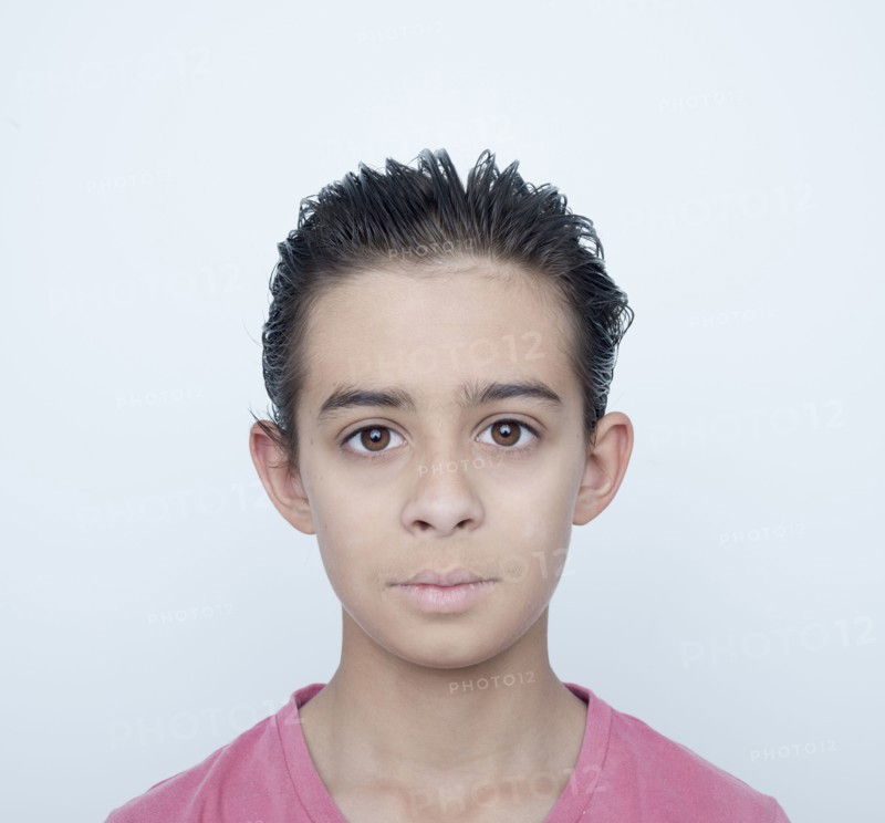 Close up of serious mixed race boy