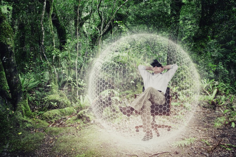 Caucasian man exploring virtual forest in bubble