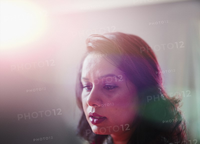 Mixed race woman looking down