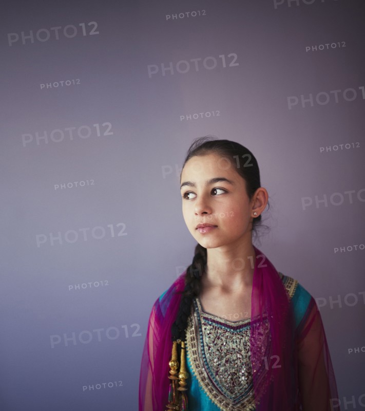 Mixed race girl wearing traditional Punjabi clothing