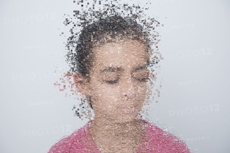 Mixed race boy with pixelated face