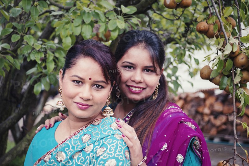 Women wearing traditional Indian dresses in garden