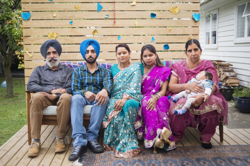 Portrait of smiling family on outdoor bench