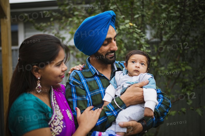 Couple admiring baby son