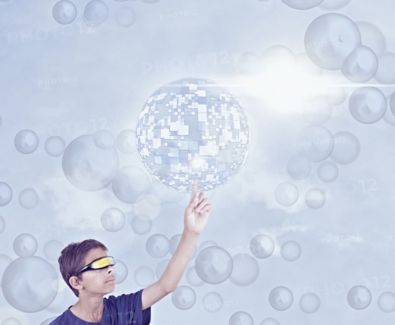 Mixed Race boy using vr goggles touching hovering pixel sphere