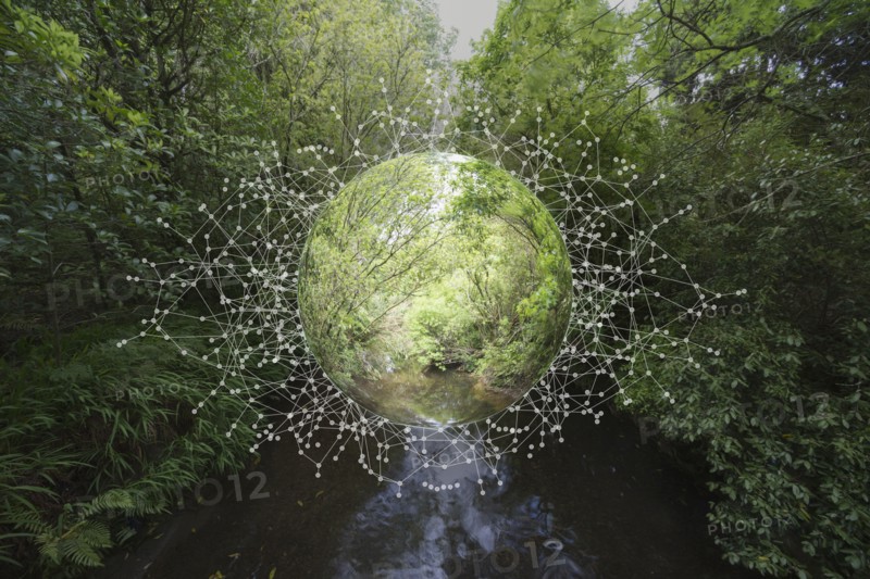 Nature sphere hovering over river in forest