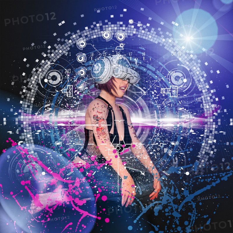 Woman with tattoos wearing virtual reality helmet
