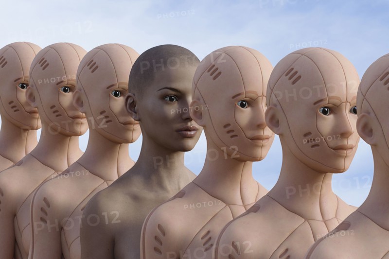 Woman standing in row of robots