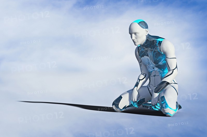 Robot man kneeling on ground