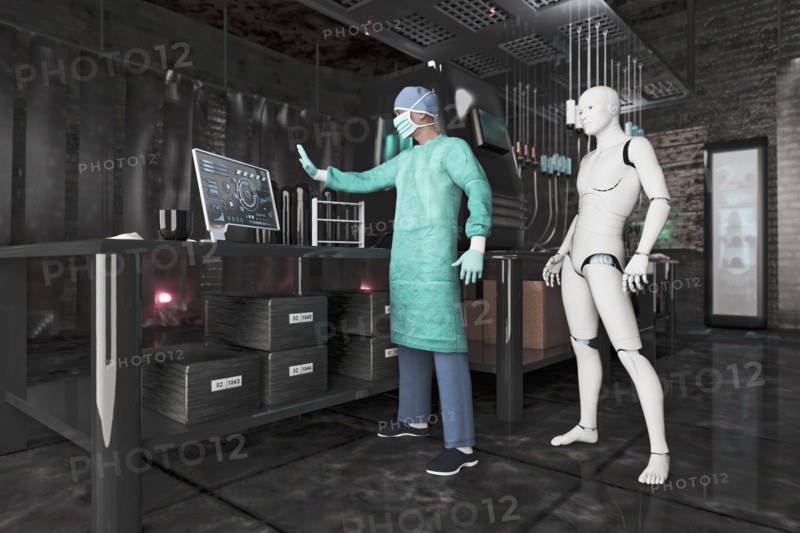 Surgeon using computer near robot woman