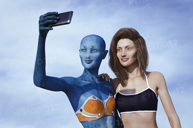 Woman and alien posing for cell phone selfie