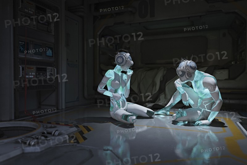 Cyborgs sitting on floor wearing virtual reality helmets