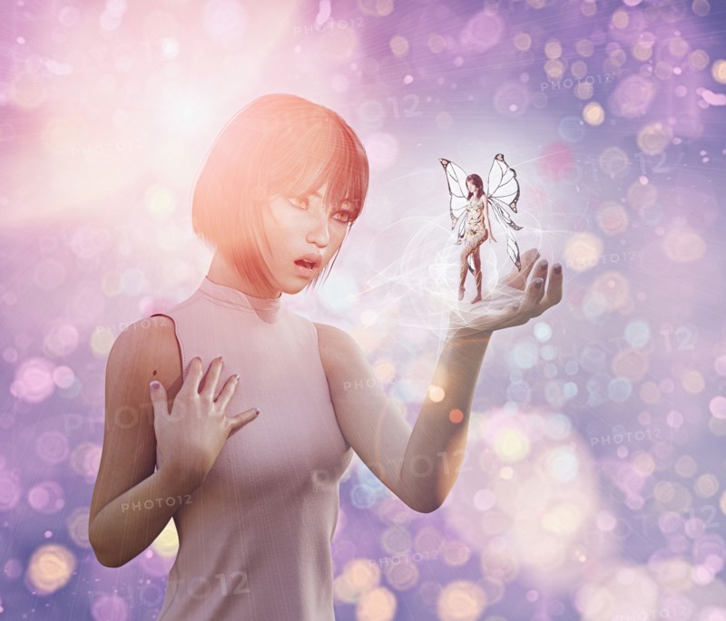 Surprised woman with fairy in hand