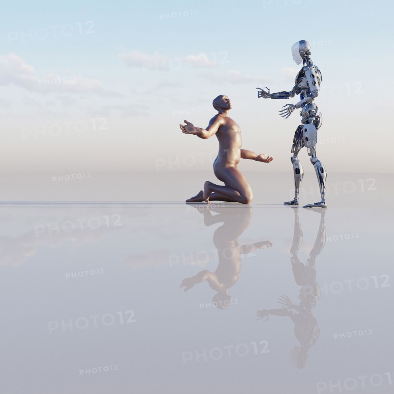 Man kneeling near robot