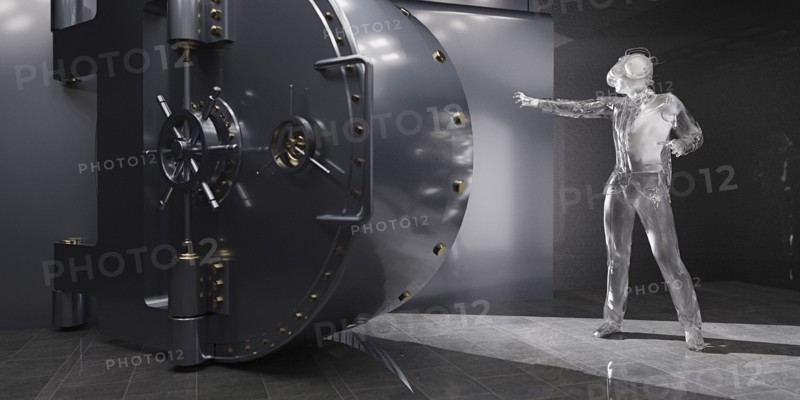 Businessman wearing virtual reality goggles opening vault