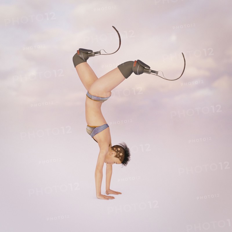Woman with artificial legs performing handstand