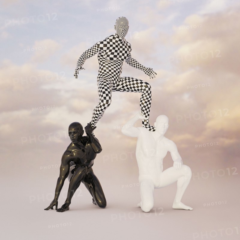 Checkered man balancing on shoulders of black and white men
