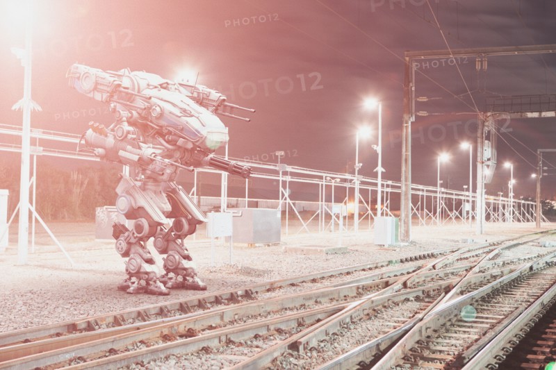 Robot aiming guns at railroad tracks