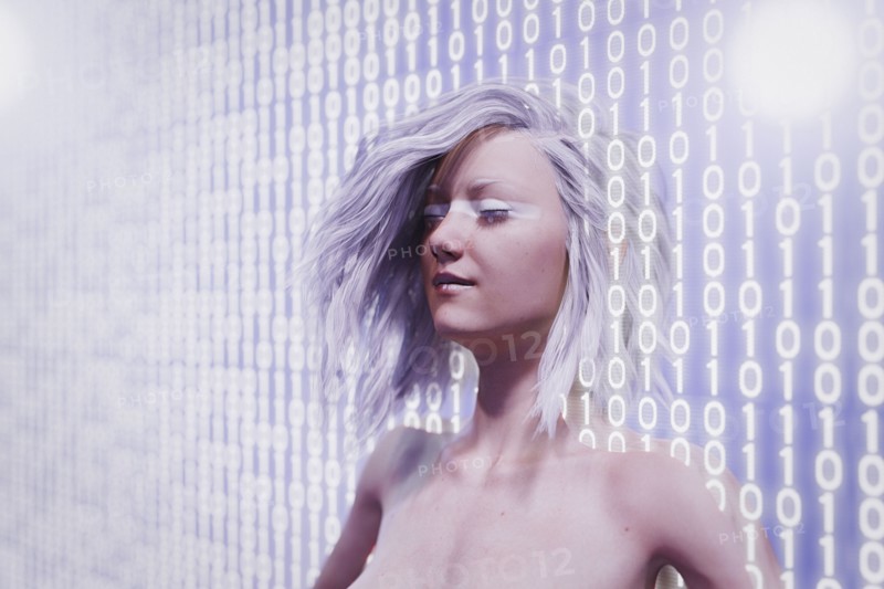 Futuristic woman standing in binary code wall