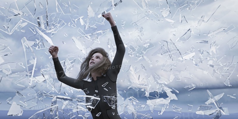 Shards of glass falling on woman
