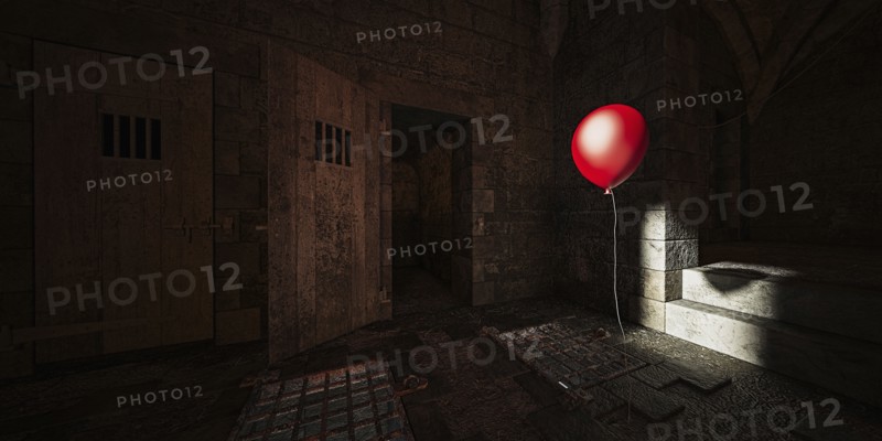 Red balloon floating in dark dungeon