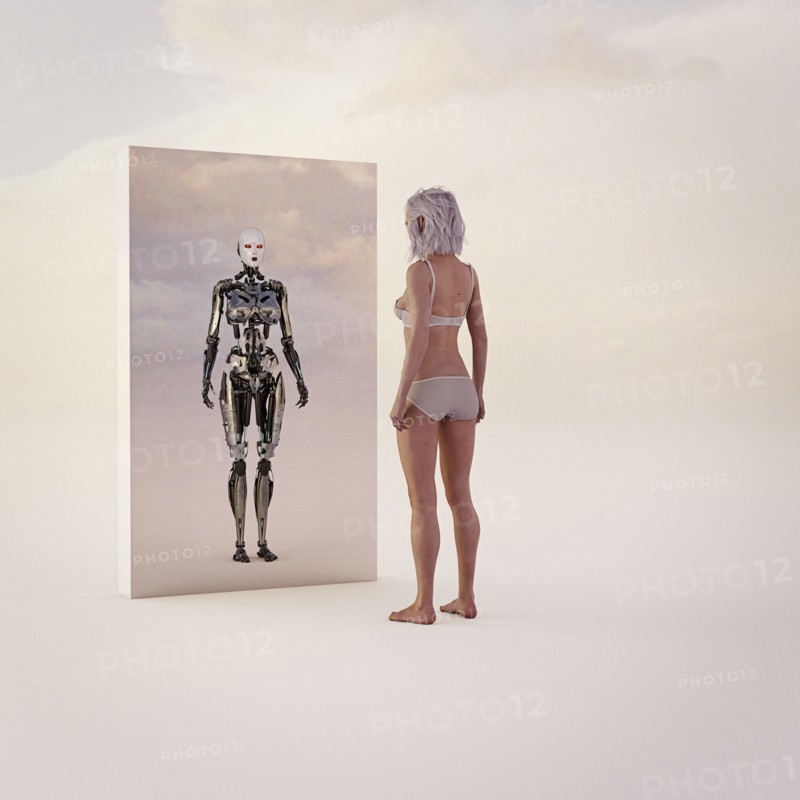 Woman looking at android reflection in mirror