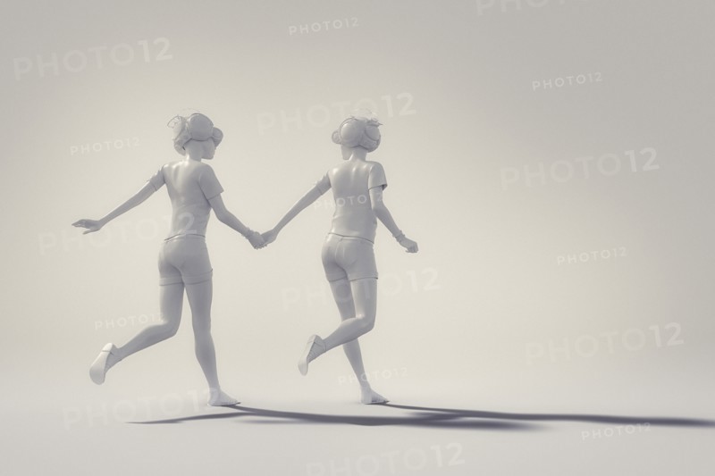 White people holding hands and running wearing virtual reality goggles